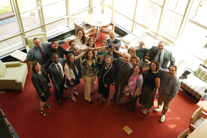 President Katherine A. Rowe and Chief Career Officer Kathleen Powell (center) with the Office of Career Development and Professional Engagement services team.