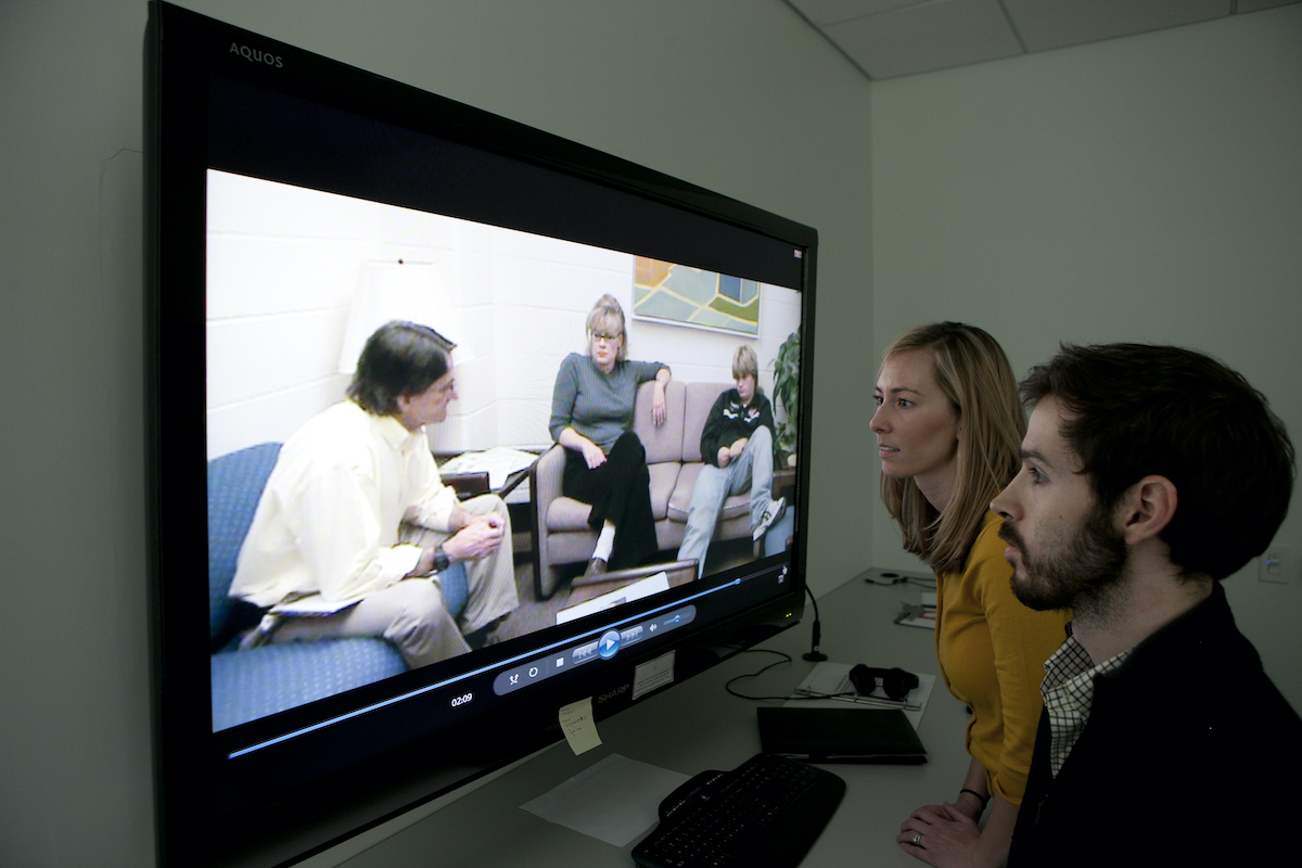 Students use observation equipment to watch  Charles “Rip” McAdams, faculty co-director of the New Horizons Family Counseling Center, conduct a mock counseling session. 