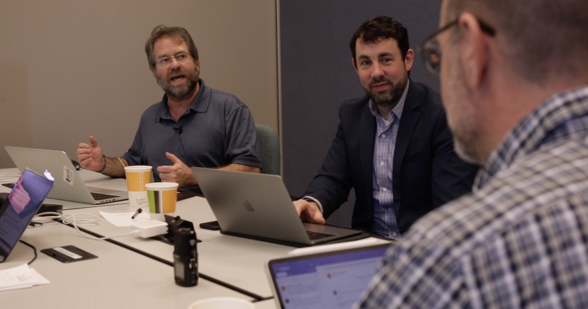 Studio for Teaching & Learning Innovation team members brainstorm strategies for the transition to remote learning during one of the last days before they began working from home. From left: Pablo Yañez, program manager; Adam Barger, associate director of academic innovation; and Mark Hofer, director. Photo credit: Roy Petersen, STLI educational media design and production specialist.